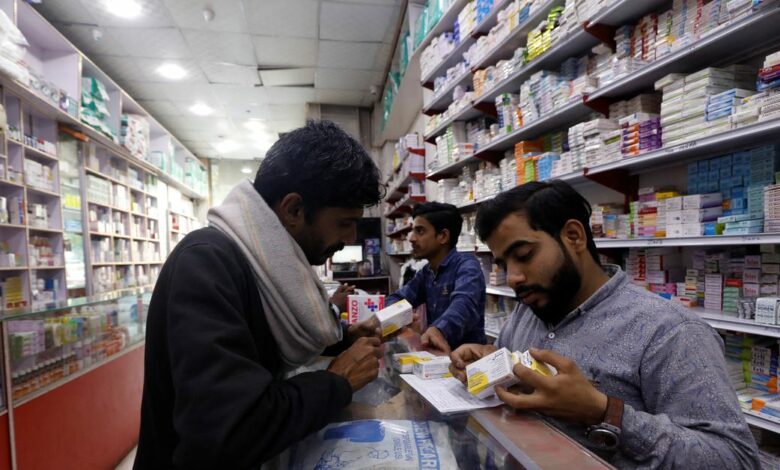 A customer buys medicine from a medical supply store in Karachi