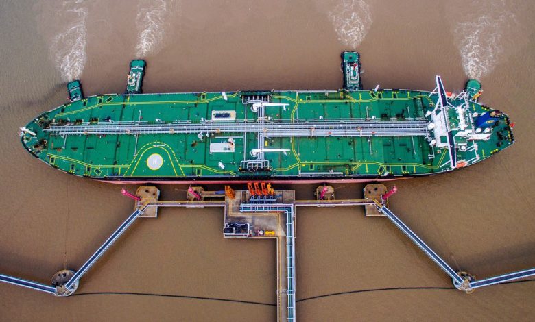 Oil tanker unloads crude oil at a crude oil terminal in Zhoushan