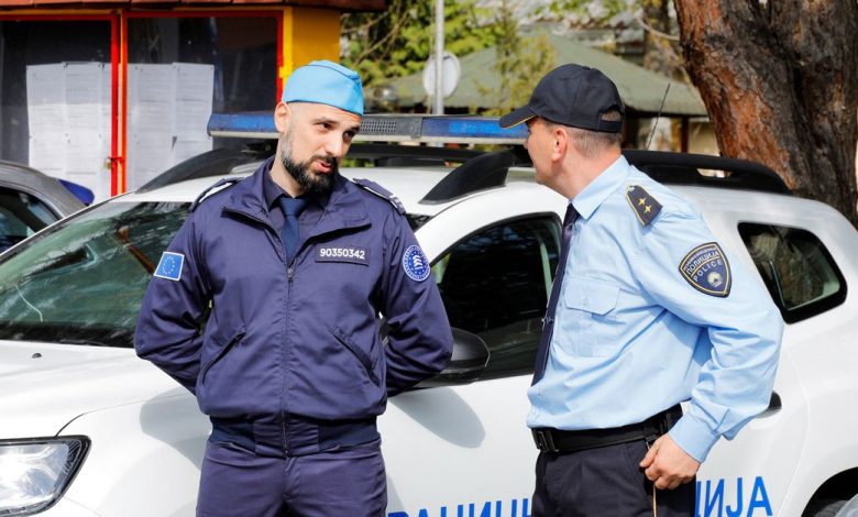 A member of FRONTEX talks with a Macedonian policeman during the ceremony for the official start of the joint border control with Macedonian police in Skopje