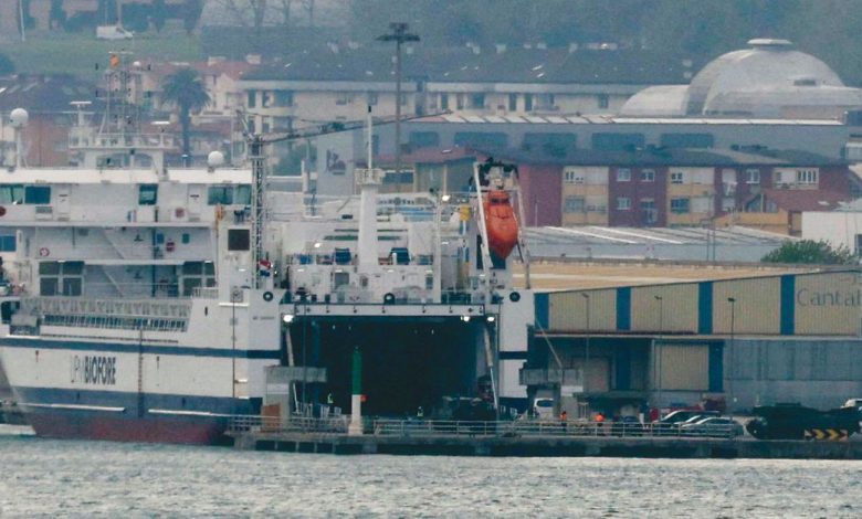 Leopard 2 6A4 tanks are driven onto a cargo ship at the port of Santander
