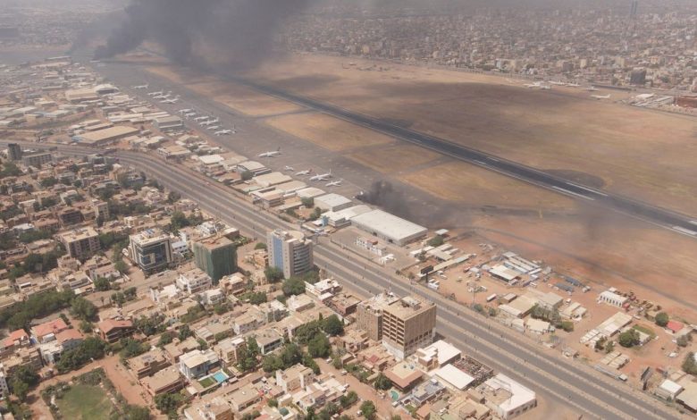 Smoke rises over the city as army and paramilitaries clash in power struggle, in Khartoum