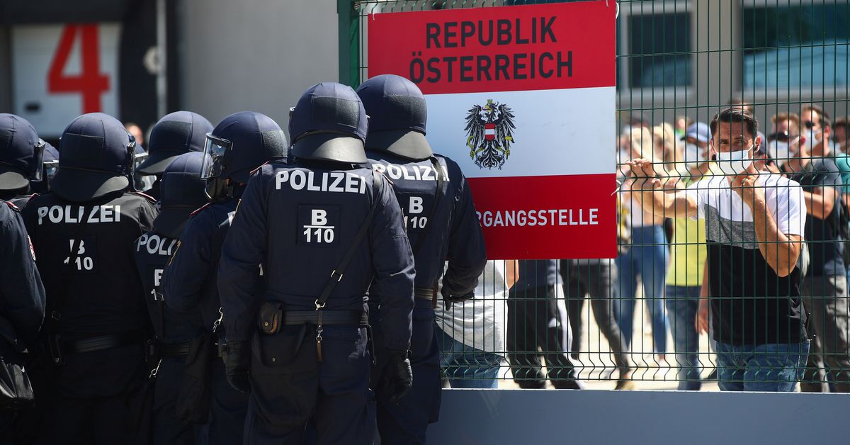 Austrian police officers attend an exercise to prevent migrants from crossing the Austrian border from Hungary in Nickelsdorf