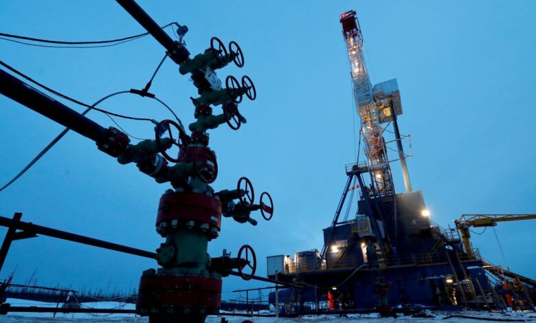A well head and drilling rig in the Yarakta oilfield in Russia