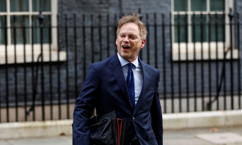 Britain's Member of Parliament Grant Shapps walks on Downing Street