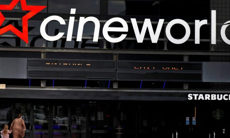 People enter a Cineworld cinema following the outbreak of the coronavirus disease (COVID-19) near Manchester
