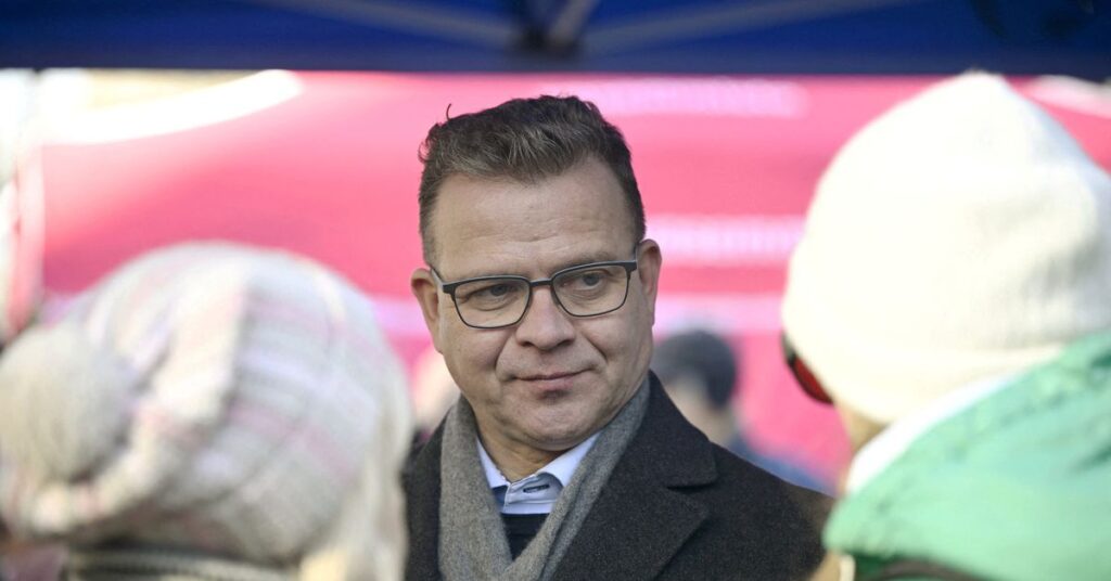 National Coalition Party chair Petteri Orpo talks with voters as he campaigns, ahead of Finnish parliamentary elections on Sunday April 2, in Vantaa