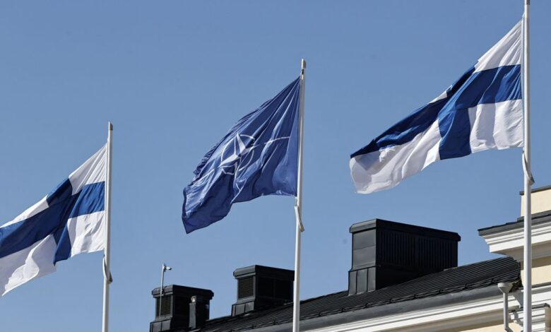 Finnish and Nato flags flutter at the courtyard of the Foreign Ministry in Helsinki