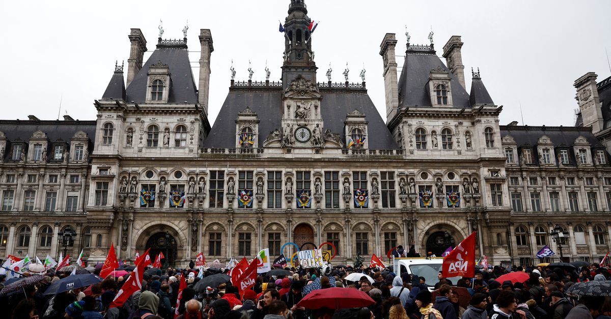 People attend a protest after Constitutional Council decision on pension reform in Paris