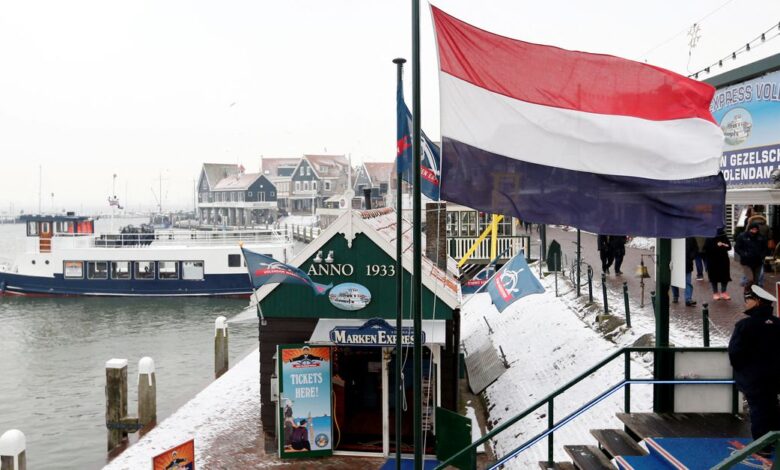 A Dutch flag floats in the port of Volendam near Amsterdam