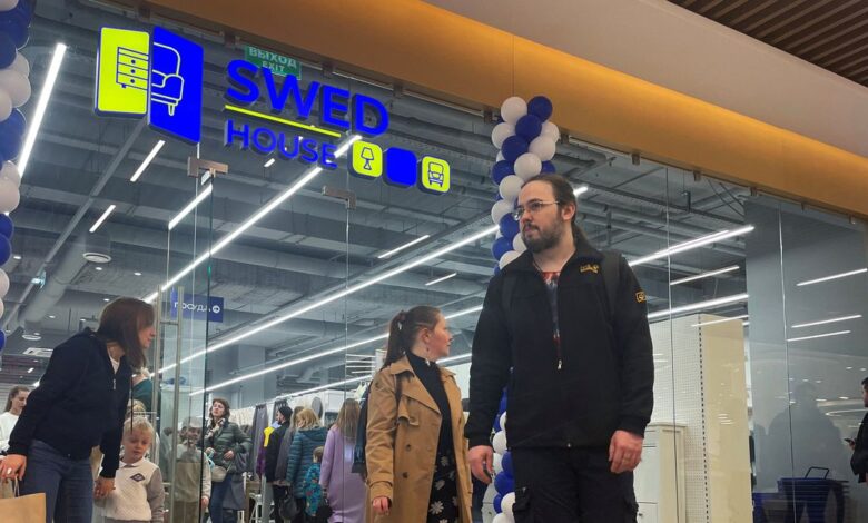 People leave Swed House store on its opening day in Moscow
