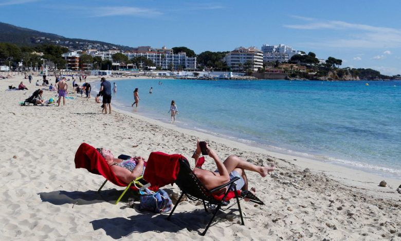 People enjoy the sunny weather on the Balearic island of Mallorca
