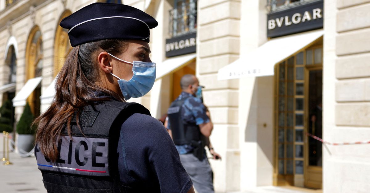 Police stand outside Bulgari in  Paris following 2021 robbery