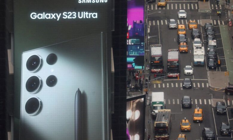 Traffic passes a Samsung Electronics Co digital billboard in the Times Square area of Manhattan