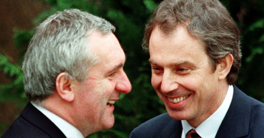 AHERN AND BLAIR EMBRACE AFTER SIGNING IRISH PEACE AGREEMENT