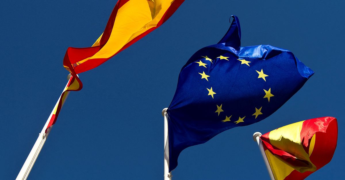 A European Union flag flies between two Spanish flags in Madrid