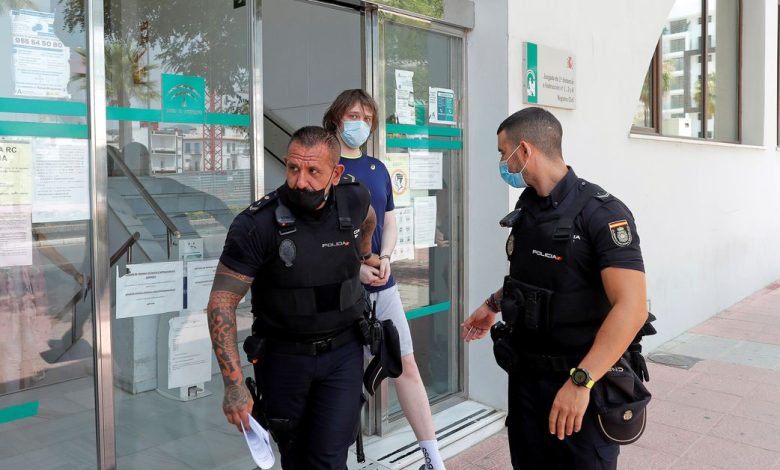 British citizen Joseph James O'Connor is lead by Spanish police officers as he leaves a court in Estepona