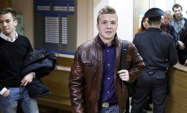 FILE PHOTO:Opposition blogger and activist Roman Protasevich arrives for a court hearing in Minsk