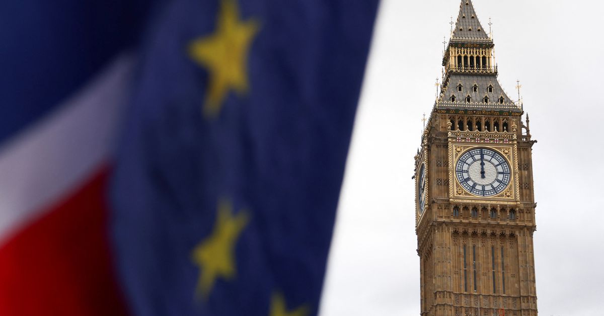 The EU and Union Jack flags are flown outside the Houses of Parliament in London