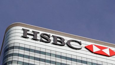 The HSBC bank logo is seen at their offices in the Canary Wharf financial district in London