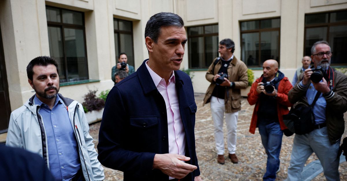 Spain's Prime Minister Pedro Sanchez appears after he casts his vote at a polling station in Madrid
