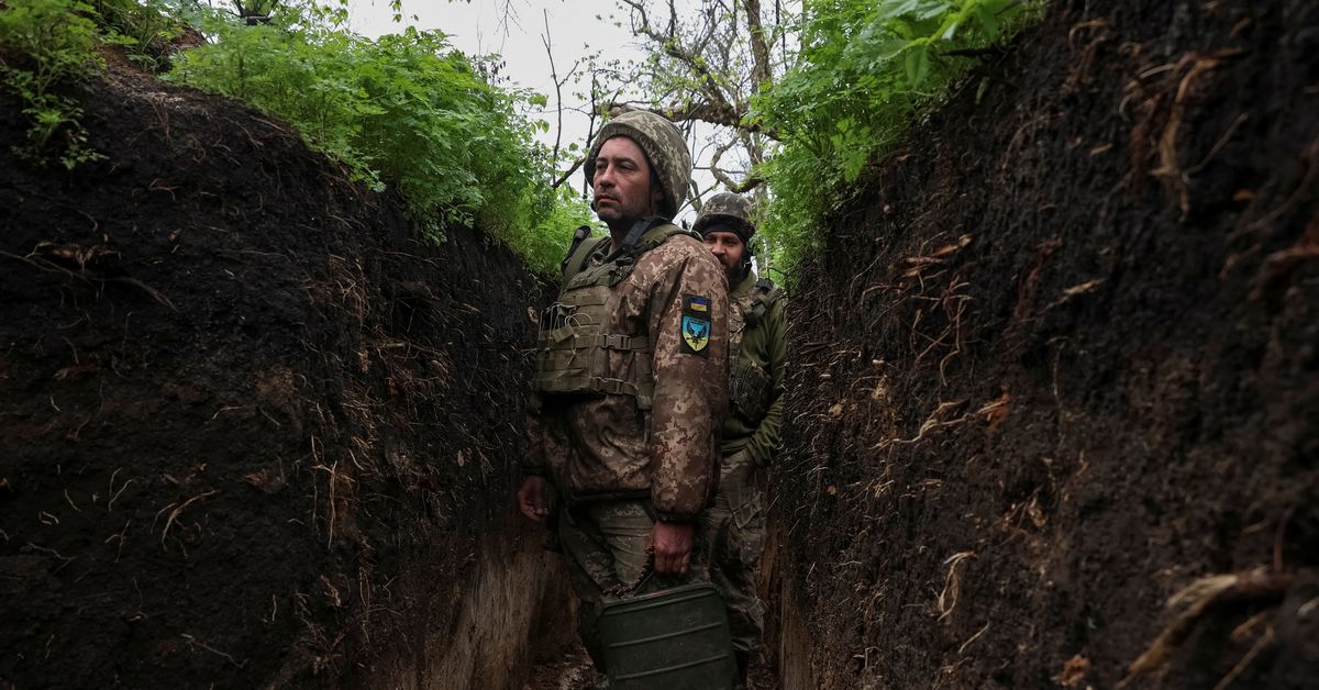 A Ukrainian service member Oleksandr, 44, is seen in a trench at a front line in Donetsk region