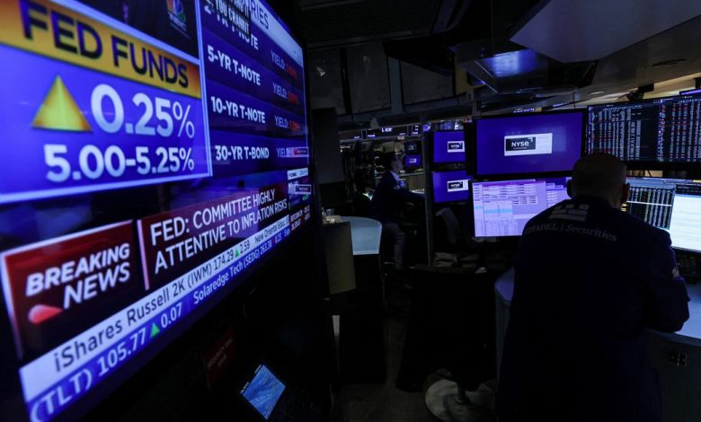 Traders react to Fed rate announcement on the floor of the NYSE in New York