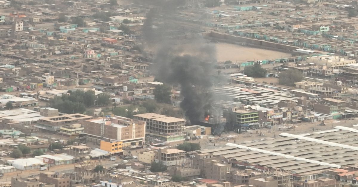 Plumes of smoke and fire at an Omdurman National Bank branch, in Omdurman