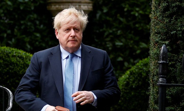 British PM Johnson walks outside his home, in London