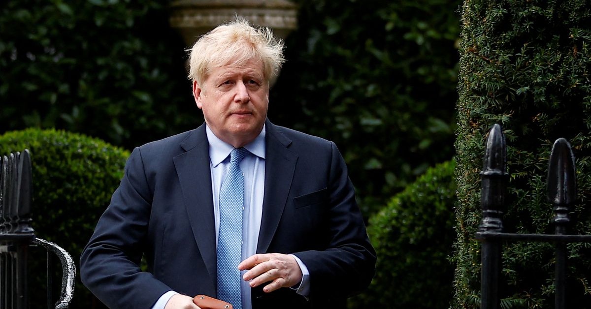 British PM Johnson walks outside his home, in London